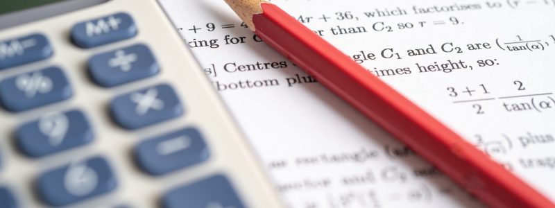 Pencil on mathematic formula exercise test paper in education school.